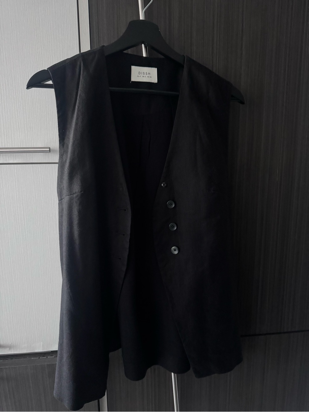 DISSH Black Long Sleeveless Vest with Button Front
